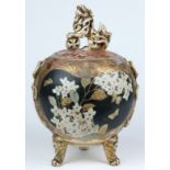 Japanese Satsuma ceramic jar, the lid with a lion form finial, above a globular body having floral