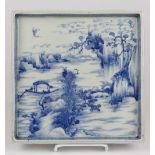 Japanese underglazed blue porcelain tray, of square form decorated with scholar on boat travelling