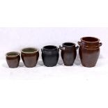 (lot of 5) Redware pottery group, each vessel with a circular mouth, some having double handles,