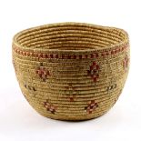 Southwest coiled basket, 20th Century, having dyed polychrome geometric patterning throughout, 6"h x