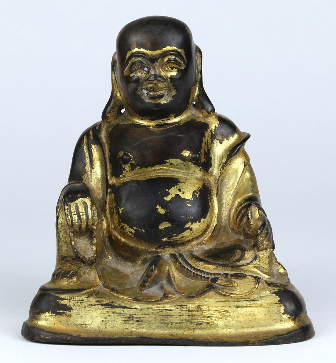 Chinese gilt bronze Budai, wearing loose robes, sitting in royal ease with right hand holding prayer