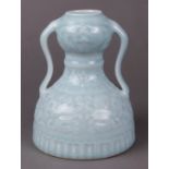 Chinese clair de lune glazed porcelain vase, with a garlic head above a small neck and domed body,