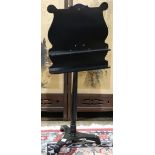 Ebonized music stand, rising on a tripod base, 42.5"h