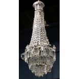 French foyer chandelier, having crystal swags surmounting the graduated prism drops, 36"h x 14"w