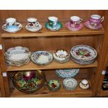 Three shelves of Continental porcelain table articles, consisting of (5) teacups with (5) saucers,