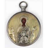 Russian travelling icon, the round silver and gilt wash oklad with a silvered bezel, 2"dia.