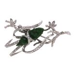 Jadeite, diamond and 14k white gold brooch Designed as a moth in branches, featuring a carved