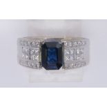 Sapphire, diamond and 18k white gold ring Featuring (1) emerald-cut sapphire, weighing approximately