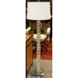 Contemporary acrylic geometric form floor lamp, having hexagonal segments continuing to the square