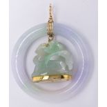 Jadeite and 14k yellow gold pendant Centering (1) carved and pierced jadeite, depicting a flower and