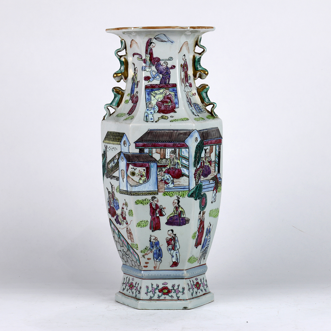 Chinese enameled porcelain vase, of hexagonal shape decorated with village scenes of figures in