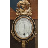 French giltwood framed barometer, the crest decorated with a bird, above the barometer centered with