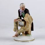 Austrian porcelain figural group, 20th Century, depicting a street performer with a crank handle