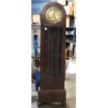 Gustav Becker tall case clock, having an Arabic numeral dial above the oak case, 76"h