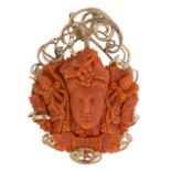 Coral cameo and 14k yellow gold pendant Featuring (5) segments of a carved coral cameo, measuring