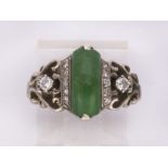 Jadeite, diamond and 14k white gold ring Centering (1) jadeite arch, measuring approximately 12 X 14