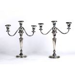 Pair of Ellmore Silver Co. sterling silver weighted candelabra, having two swing arms with three