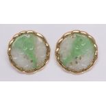 Pair of jadeite and 14k yellow gold earrings Featuring (2) carved and pierced jadeite plaques,