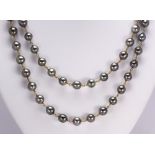 Tahitian cultured pearl, yellow gold necklace Composed of (57) graduating Tahitian grey cultured