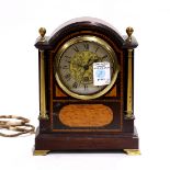 Manning Bowman mantle clock, the rounded stepped cornice over a dial having Roman numerals,