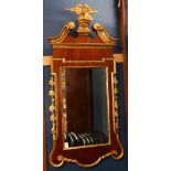 Period Federal looking glass, having a giltwood eagle finial surmounting the mahogany frame with