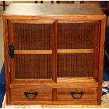 Japanese tansu cabinet, with a pair of sliding doors in the pattern of bamboo slats, above a row