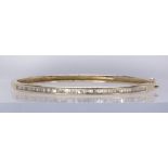 Diamond and 14k yellow gold bracelet Featuring (64) baguette-cut diamonds, weighing a total of