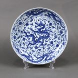 Chinese underglaze blue porcelain charger, featuring meandering dragons amid floral scrolls, 13"w