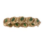 Jadeite and 14k yellow gold bracelet Featuring (11) pear-shaped jadeite cabochons, measuring