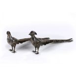 Pair of American silvered metal pheasants, model as a male and female; 7"h x 15"l x 3"d