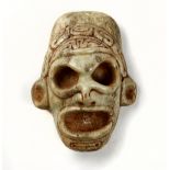 Taíno society small mask, following the Taino custom of miniaturization, made from verigated marble,