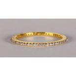 Diamond and 18k yellow gold eternity band featuring (55) full-cut diamonds, weighing a total of