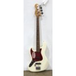 Fender 4-string electric guitar, left handed, in a fitted canvas case, 46"l