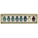 Set of eight Chinese cloisonne enameled vases, in graduated stages of the cloisonne process, in box,