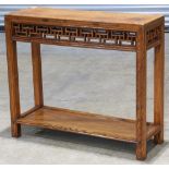 Chinese two tiered wooden side table, the top inset with a narrow floating panel, fronted by an