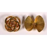 (Lot of 2) 14k yellow gold brooches Including 1) 14k yellow gold ribbed, fan motif twist brooch,