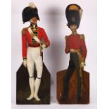 (lot of 2) English paint decorated dummy boards, each depicting a figure of a soldier wearing a