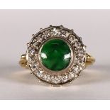 Jade, diamond and 14k yellow gold ring Centering (1) round jade cabochon, measuring approximately