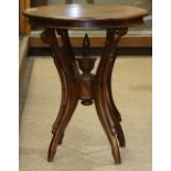 Victorian walnut occasional table, having a circular top, above a quadruped base, 28"h x 23"dia.