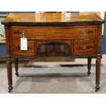 George IV mahogany inlaid server, having a shaped top with ebonized marquetry accents, above the