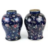 Pair of Chinese enameled porcelain jars, each with a short neck on rounded shoulders and tapering