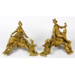Pair of Louis XV style gilt bronze andirons, each decorated with a figure of a youth dressed in