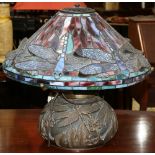 Tiffany style lamp, having a domed shade with dragonfly motif, above the bulbous body, 16"h x 18"