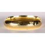 14k yellow gold bracelet The 14k yellow gold bangle, measures approximately 13.5 mm in width and