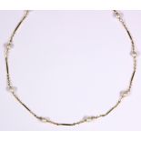 Cultured pearl and 14k yellow gold necklace Composed of (10) 5.50 mm, cultured pearls, interspaced