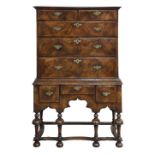 George I walnut chest on chest, early 18th century, having a molded top, above the upper graduated