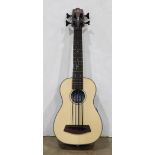 U bass 4-string small guitar, left handed, in a fitted canvas case, 29"l