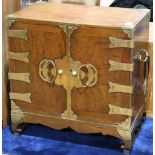 Korean wood cabinet, fronted by a pair of hinged double doors, concealing rows of small drawers to