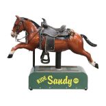 10 cent "Ride Sandy" kiddie ride, the horse executed in brown, wearing a saddle, and rising on a