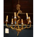 French Rococo style chandelier, the gilt six light fixture having stylized floral supports